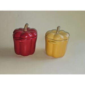 Nice ceramic yellow and red bell pepper‎ jars with lids.